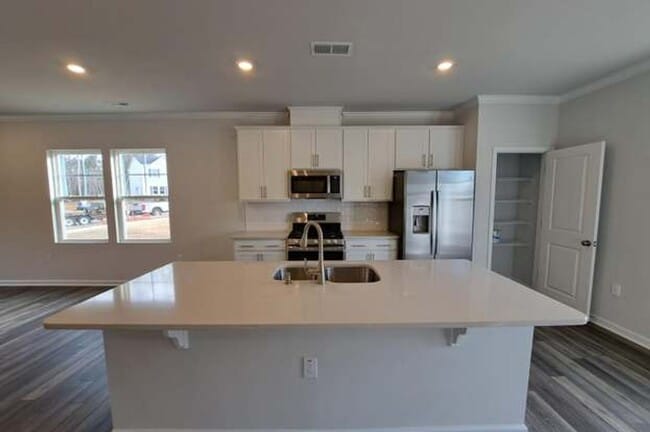 Photo - 3 BR/2.5BA | Newly Renovated Townhome End Unit | Private Patio| In Raleigh!