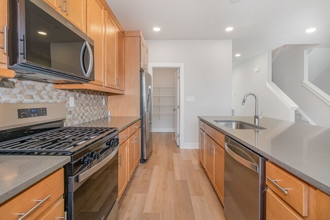 Photo - Modern 2025 Townhome | Open-Concept Living, Chef’s Kitchen with Large Island & 2-Car Garage
