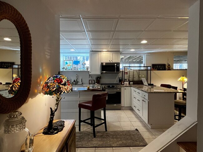 Spacious kitchen & center island workspace - 142R Page Rd Unit BedfordWithGarage