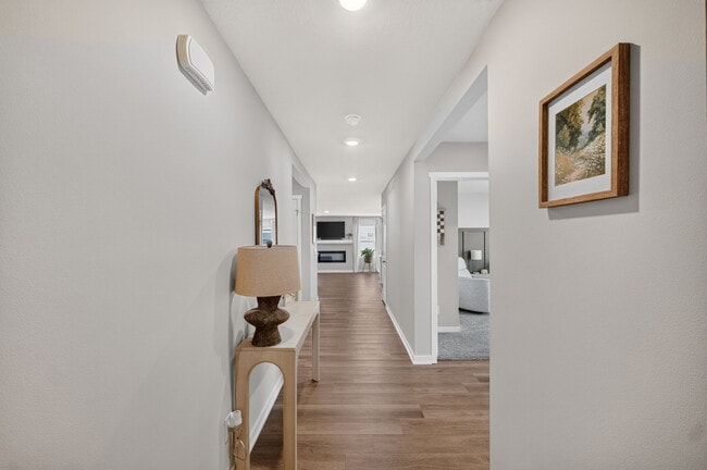 hallway leading to bedrooms, bath and laundry