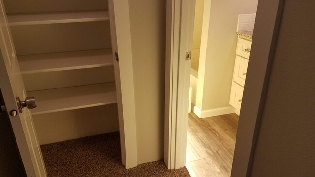Upstairs hall closet - 1565 Madras St SE Unit 1