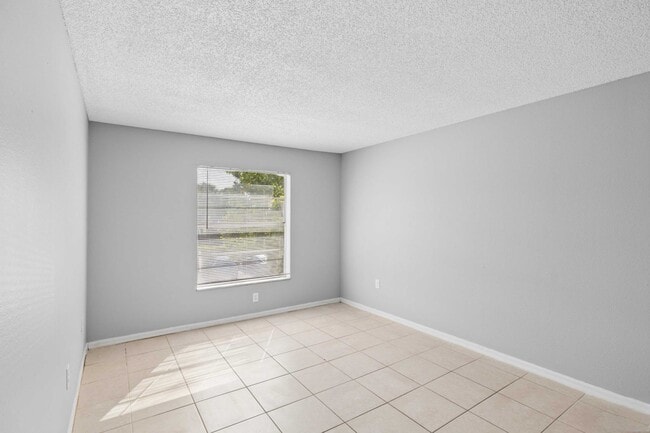 Step into the bright, spacious interiors of Clear Lake Palms Apartments, where modern design meets comfort. Enjoy tiled flooring, fresh paint, and ample natural light in this inviting living space. Schedule your tour today!