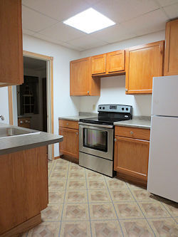 Kitchen with glass-top stove - 120 N Lake St Apartments Unit 2