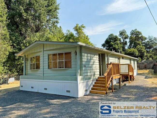 Building Photo - Roomy 2 bd. mobile w/ big yard in a countr... Rental