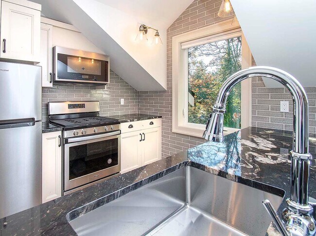 Photo - Expansive Loft-Style Carriage House in Private Haller Lake Estate