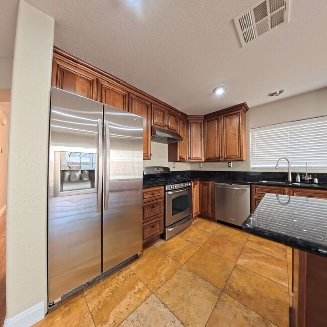 Photo - Stunning 2-Story Home with a Bedroom downstairs and a Backyard Oasis.