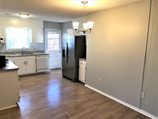 Photo - SW Large Brick Home, Updated Kitchen & Bathrooms, Wood Like Flooring, Fenced Yard!