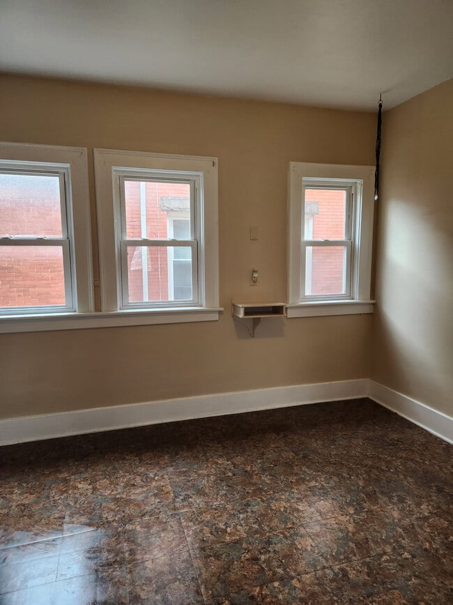 A large kitchen with lots of natural light. - 446 W 7th St Unit 1st Floor