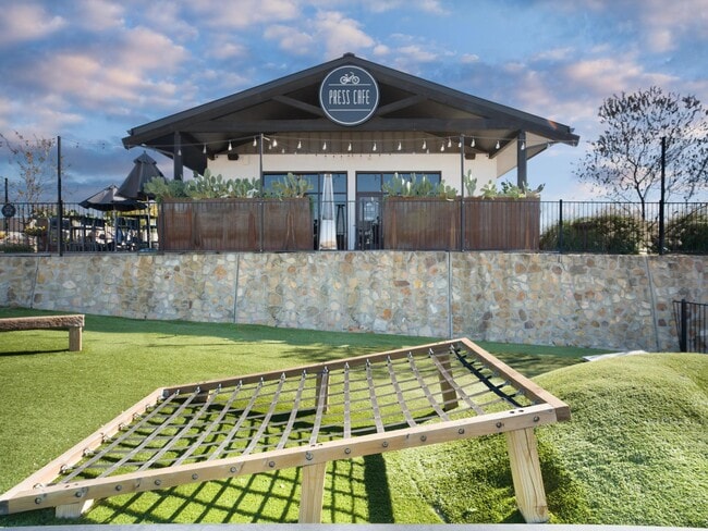 Press Café at The District offers a relaxed outdoor setting for coffee or bites, just minutes from Modera Walsh Heights.