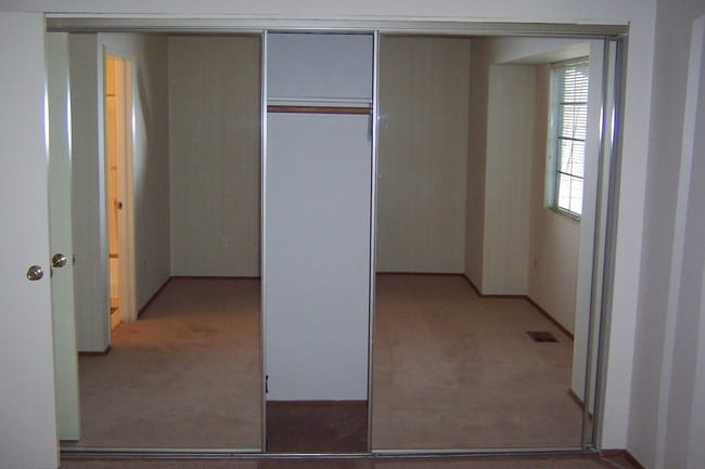 Closet with three mirrored panels