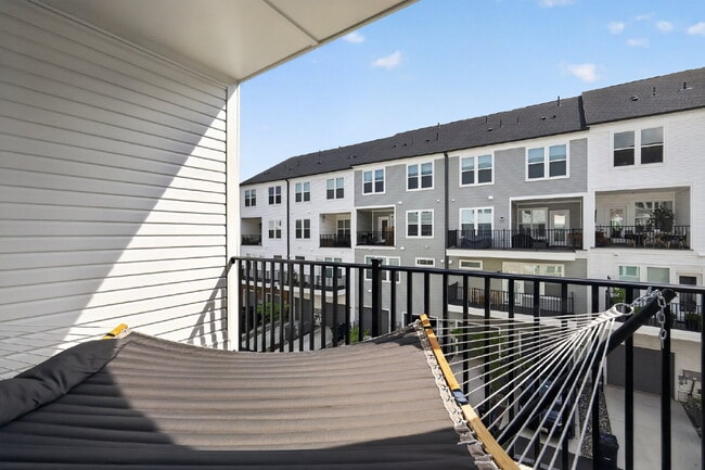 Photo - Stunning 2-Level Top Floor Condo with Tesla Charger & 70" TV – Farmstead District