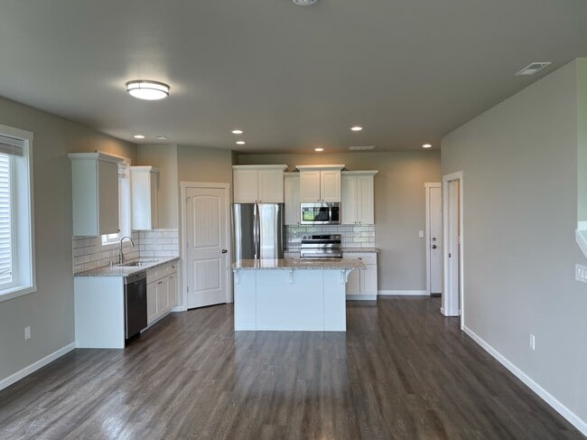 Kitchen from dining area - 9016 W Winona Rd