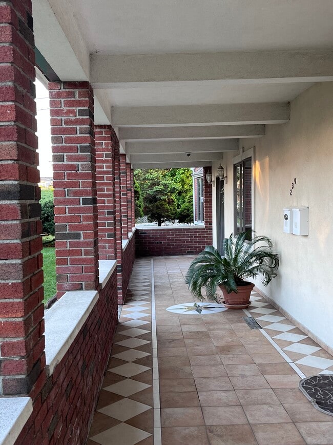 covered porch entry with left door street level acess - 239 Kingston Ave Unit apartment on 2 floors