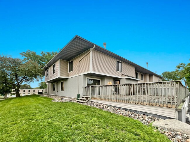 Building Photo - Spacious End-Unit Townhome with Fireplace, Family Room, 2-car Garage, Community Pool & Playground...