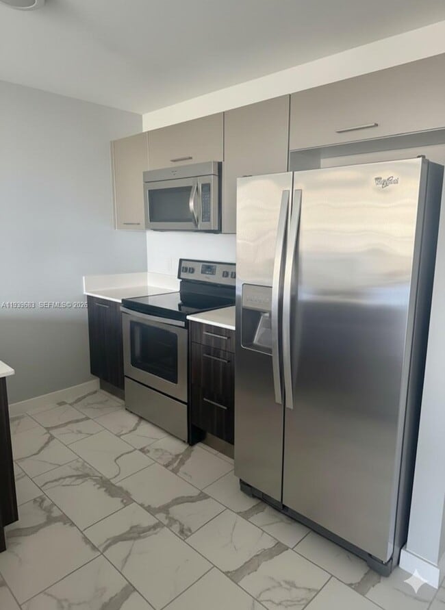 Building Photo - 101 E Camino Real Unit 830