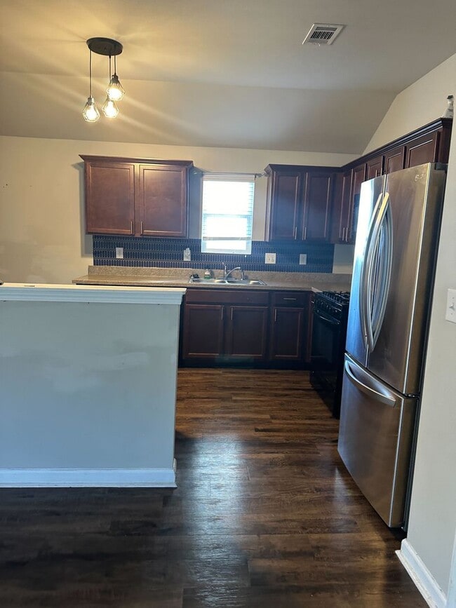 Photo - Stylish 4BR/2BA Home with Garage & Privacy Fence