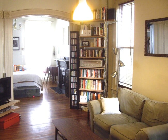 Older photo of the Mid room looking forward , furnished (pocket doors fully opened) - 22 Lyon St Unit 1 floor walkout garden