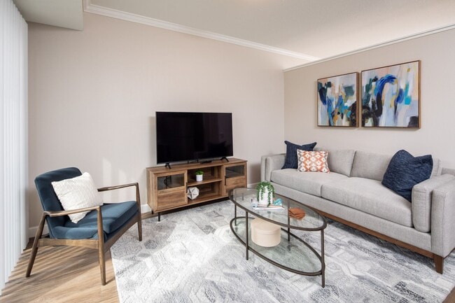 View of cozy model living room at The Whitley. - The Whitley