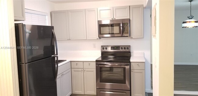Building Photo - 8130 Sunrise Lakes Blvd Unit 206