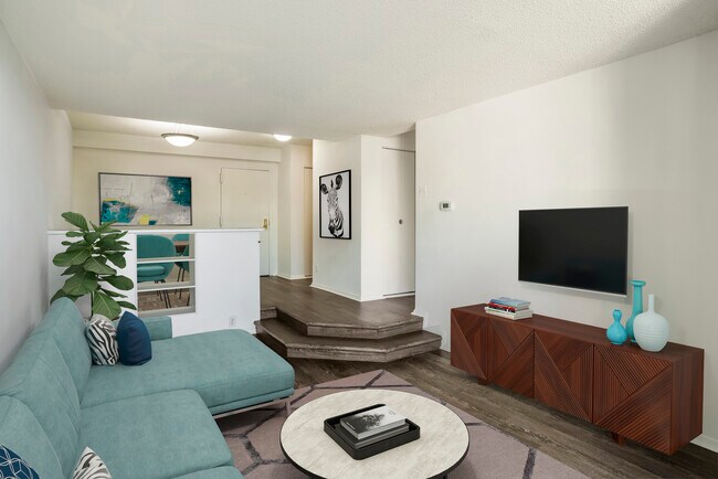 Renovated Package I dining and living areas with hard surface flooring - AVA Van Ness