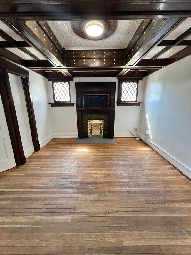 Photo - Stylish 2-Bedroom Unit Featuring Decorative Fireplace