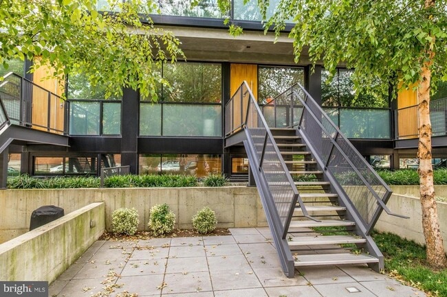 Private street-level entrance and a 400 sq. ft. walled-in patio facing 11th Street NW. - 2250 11th St NW Unit 103