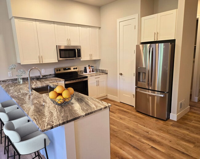 Chef's Kitchen with Modern Touches - Hideaway Apartments