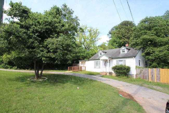 Building Photo - Updated Multi-Bedroom Home | Brand-New Deck | Circular Drive | Triad Premier Realty