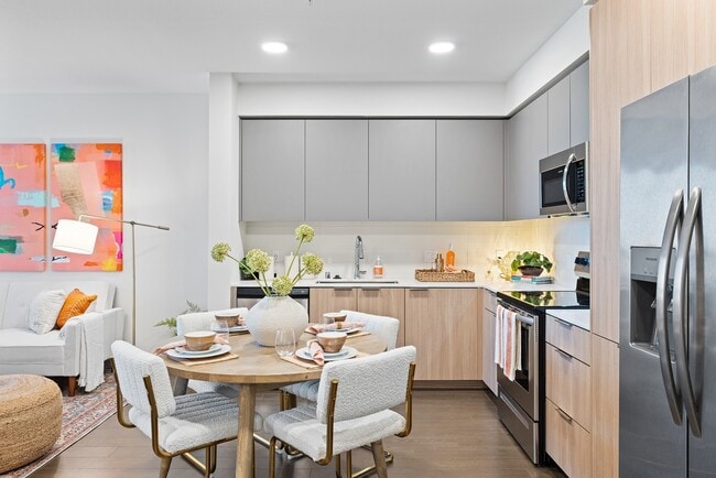 Cook, dine, and unwind in this beautifully designed modern kitchen and dining space, where style meets everyday functionality. - The Grant Rental