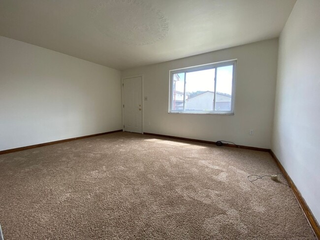 Photo - Charming Two Bedroom Townhome with a Private Basement & a Shared Backyard Space! Call Today!