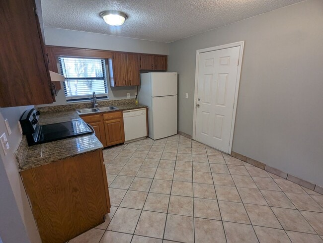 Photo - Spacious 2-Bedroom, 1-Bath First-Floor Condo for Rent. Furry friends welcome! Unit 6