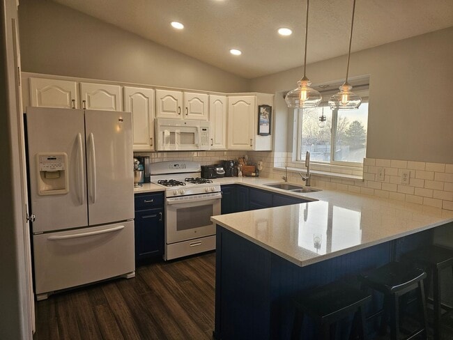 Photo - Spacious 4-Bed, 2-Bath Pet-Friendly Home with Central Air & 2-Car Garage! - Available NOW!