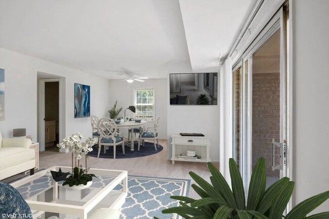 Bright living space with ceiling fan