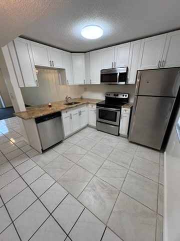 Building Photo - 5002 Bordeaux Village Plz Unit 102