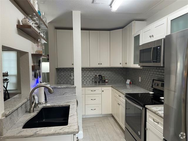Building Photo - 3904 Rawlins St Unit 113 Rental