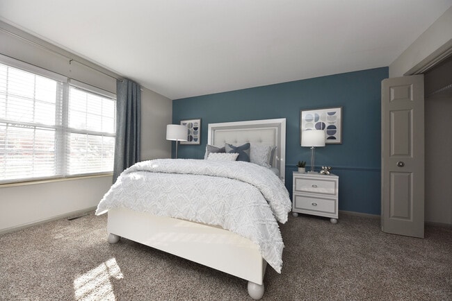 Experience tranquility in this beautifully styled bedroom, perfect for relaxation. - Everly at Meridian Hills