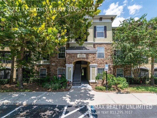 Building Photo - 10211 Courtney Palms Blvd Unit 103