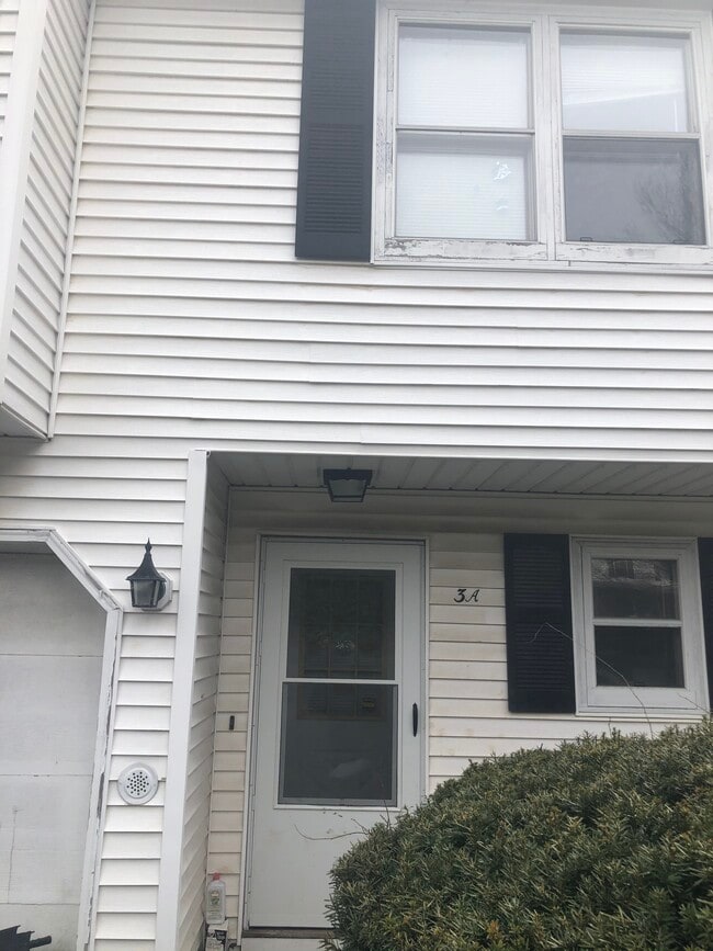 Front entrance and the garage - 3 Chrisken Dr Townhome