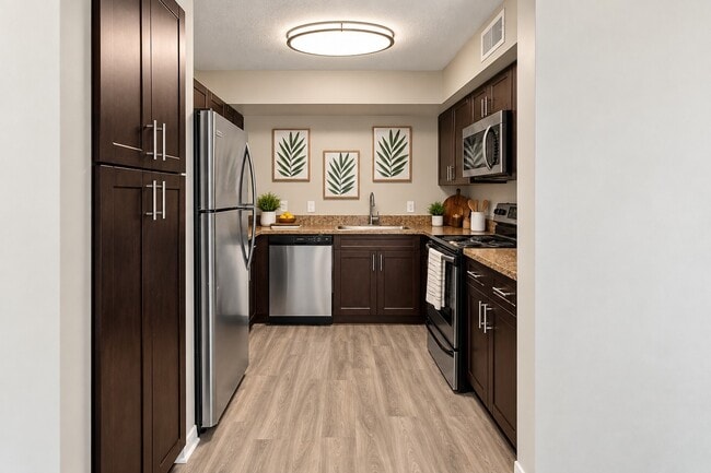Step into the inviting kitchen at Club Mira Lago, where modern elegance meets functionality. Enjoy stylish cabinetry and sleek appliances, perfect for culinary creativity. Ready to elevate your lifestyle? Schedule a tour today!