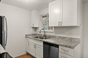 Experience culinary delight in this modern kitchen adorned with high-end finishes.