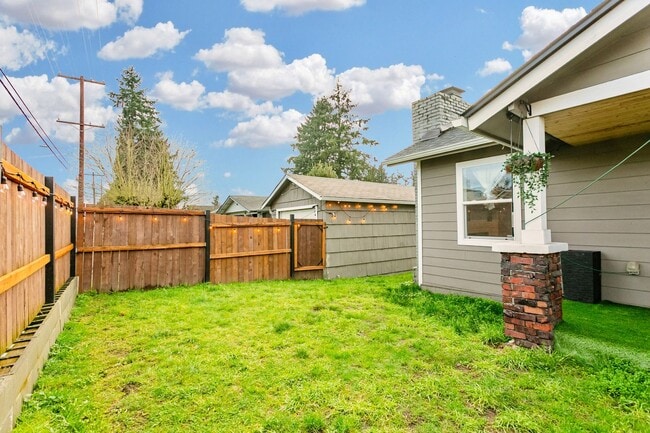 Photo - Spacious 4-Bedroom Tacoma Home with Fireplace & Deck **$500 OFF FIRST MONTHS RENT**