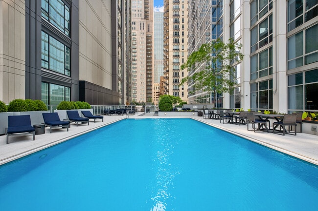 Outdoor Pool and Lounge Space - Two West Delaware Apartments