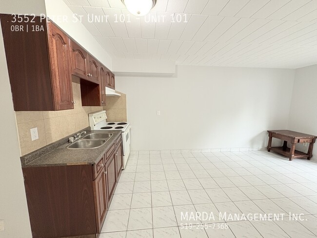 Photo - COZY MAIN FLOOR BACH NEAR U OF W - INCLUSIVE! Unit 101