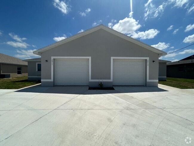 Building Photo - New construction 3/2 duplex -1 car garage Unit 2911 Santa Barbara Blvd Rental