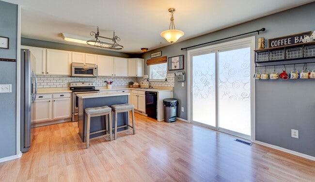 Photo - Evolve Real Estate: Available 06/03/2026 Beautiful 3 Bedroom + Loft + Finished Basement in the Po...