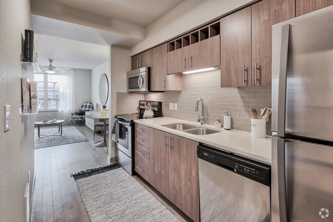 Kitchens feature built-in microwaves and stainless steel appliances - Platform 14 Rental