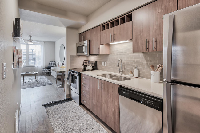 Kitchens feature built-in microwaves and stainless steel appliances - Platform 14 Apartments