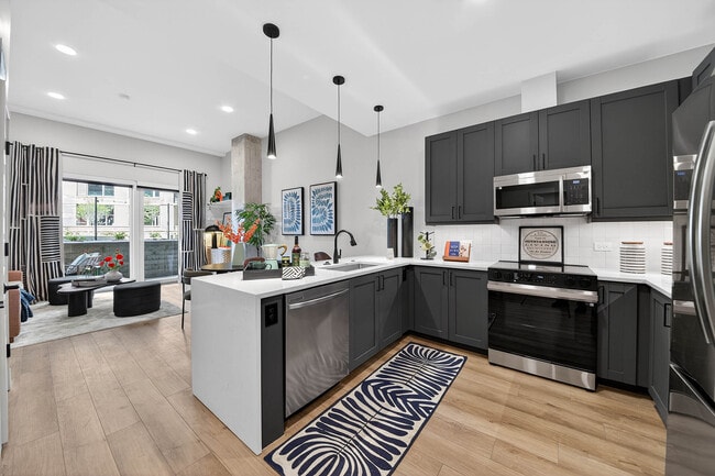 Chef's kitchen with waterfall quartz countertops