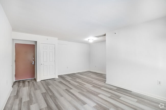 3BR, 1.5BA - 878SF - Living Room & Dining Room