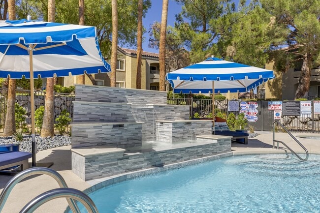 The centerpiece of the deck is an elegantly updated waterfall, adding a touch of tranquility with its soothing sounds. - Aviara Apartment Homes